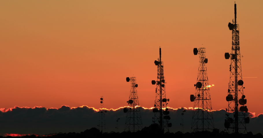 Telecom Towers Transmitter Antennas Trellis 5G Red Light Sunrise Time Lapse Royalty-Free Stock Footage #1071464431