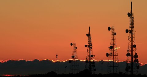 Telecom Towers Transmitter Antennas Trellis 5G Red Light Sunrise Time Lapse