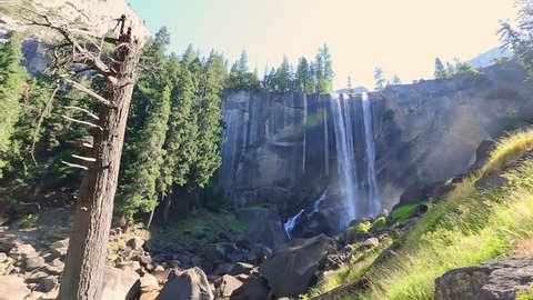 panorama of Vernal Fall waterfall on Merced River from Mist Trail in Yosemite National Park. Summer travel holidays in California, United States.