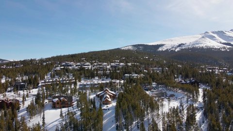 Aerial view buildings a and houses in Breckenridge, sunny Colorado - low, drone shot
