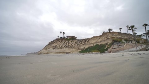 Scenic Solana Beach, San Diego, California USA. Gey Sand and Washed Cliff With Villa, Slow Motion