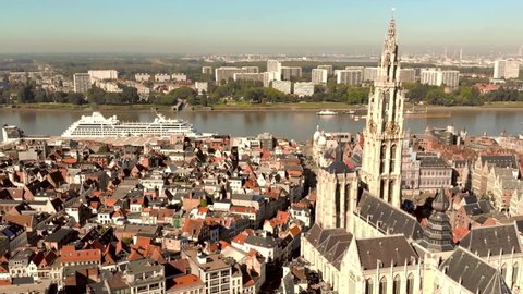 Cathedral of Our Lady amid Antwerp cityscape and Scheldt river, Belgium - Aerial wide Panoramic shot