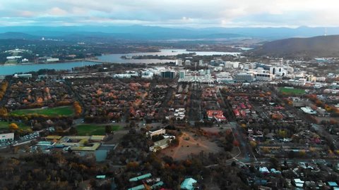 Canberra City Centre Upwards Flying Drone Shot At Sunset Overlooking Canberra City Centre, With Lake Burley Griffin In The Background. Canberra, Australia