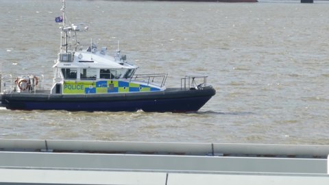 Liverpool , United Kingdom (UK) - 03 02 2020: Police force emergency patrol guarding River Mersey on windy tide