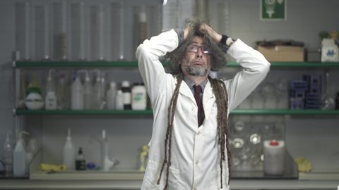 Funny confused dizzy scientist professor after attempting a crazy experiment in the lab