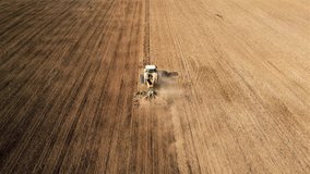 farm tractor sowing field aerial video