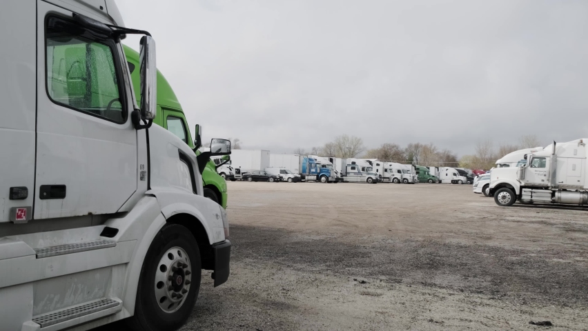 Several trucks stand in the parking lot. USA