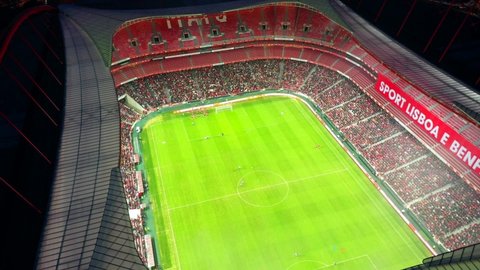 Lisbon , Portugal - 02 05 2020: Aerial, tracking, drone shot, overlooking a halftime show on a football field, inside the Benfica stadium, at night time, in Lisbon, Portugal