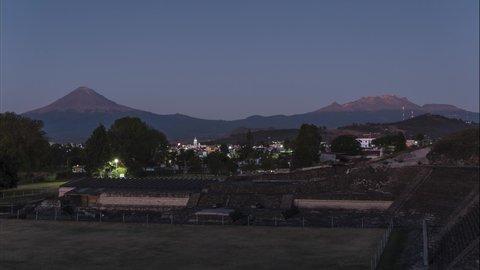 Sunrise time lapse in the archeological area of the pyramid of Cholula, with Popocatepetl and Iztaccihuatl volcanoes in the background