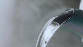 Slow motion hot water pouring from a teapot. Hot water is pouring from the kettle.  - Powered by Shutterstock - Get 15% off with code: PIKWIZARD15