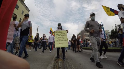 Cali, Colombia - April 28 2021: Thousands of Colombians march to protest government tax reform - Fiscal reform during the Coronavirus pandemic