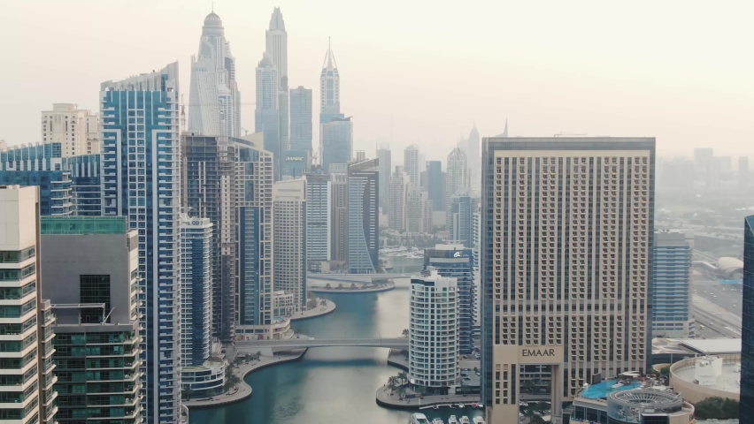 Go Everywhere, massive buildings of Dubai Marina, view on Dubai Creek, 4k