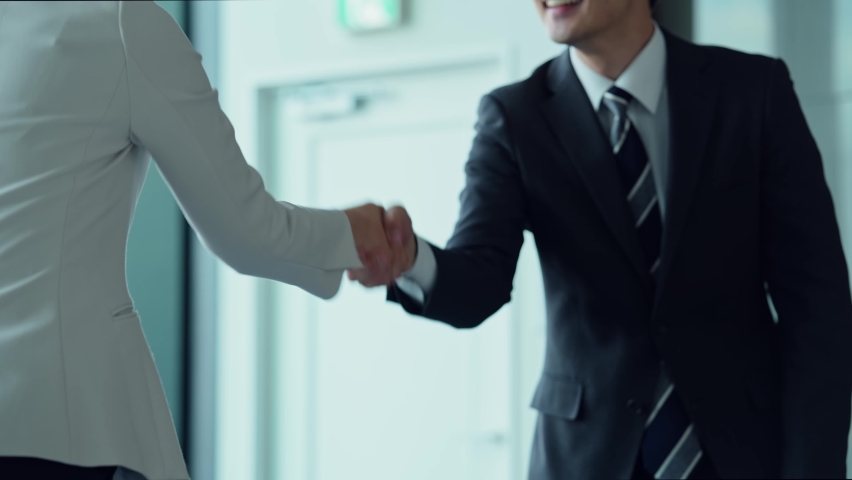 Group of asian businessperson shaking hands. Success of business. | Shutterstock HD Video #1071551377