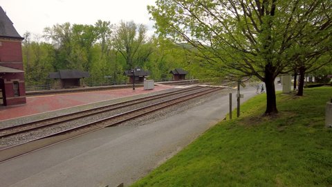 Point of Rocks is a small town on the border of Virginia and Maryland, with historic buildings. Footage shows historic brick railway station build in 1873 as part of Baltimore Ohio railroad