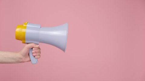 Cropered shot of unrecognizable young woman hold bullhorn public address megaphone, Hot news, announce discounts sale, hurry up, isolated on pink background wall with copy space. Communication concept