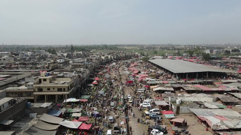 Islamabad, Pakistan - April 14,2021 
 Day time aerial drone shot of a busy market