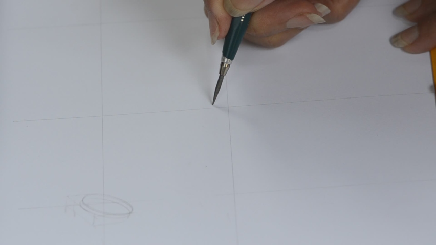 The designer is sketching a picture of the jewelry ring.