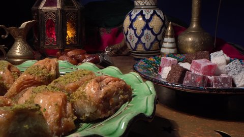 Traditional Oriental Arabic sweets, dates, nuts and fruits. Iftar party table. Ramadan Night