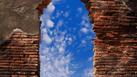 Wall bricks gateway portal door hole sky clouds