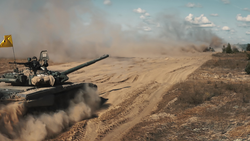 Tanks drive aerial. Army training. Military armored machine. National defense. Power demonstration at dry desert field. Vehicle riding at dust clouds. Armoured transport. Battlefield war cinema scene