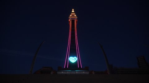 4K: The Blackpool Tower, England, UK at Night. It's illuminated and Lit up in the dark. Stock Video Clip Footage