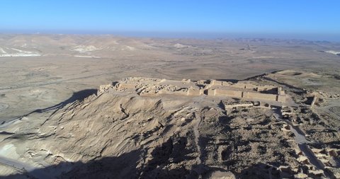 4K drone shot of the Avdat Ruin in the Negev Desert in southern Israel, Avdat nationalpark on a sunny day with a blue sky, aerial view of a site of a ruined Nabataean city, in the Middle East