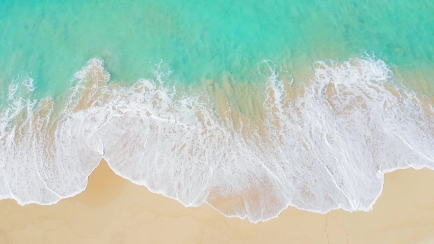 Top view of beautiful sand beach with azure seawater, Wave propagation, aerial shot from drone camera. | Shutterstock HD Video #1071579469