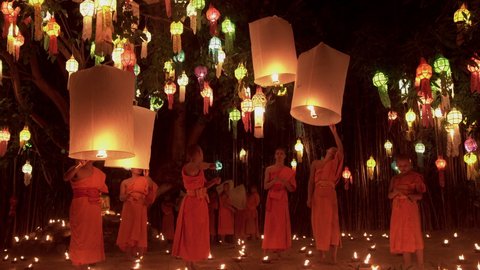 Chiang Mai, Thailand. 11th Nov 2019. Thai Buddhist monks release Lanna lantern  during Yi Peng Festival.