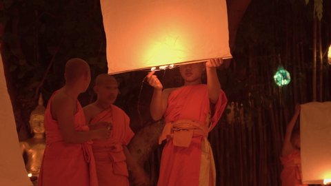Chiang Mai, Thailand. 11th Nov 2019. Thai Buddhist monks release Lanna lantern  during Yi Peng Festival.