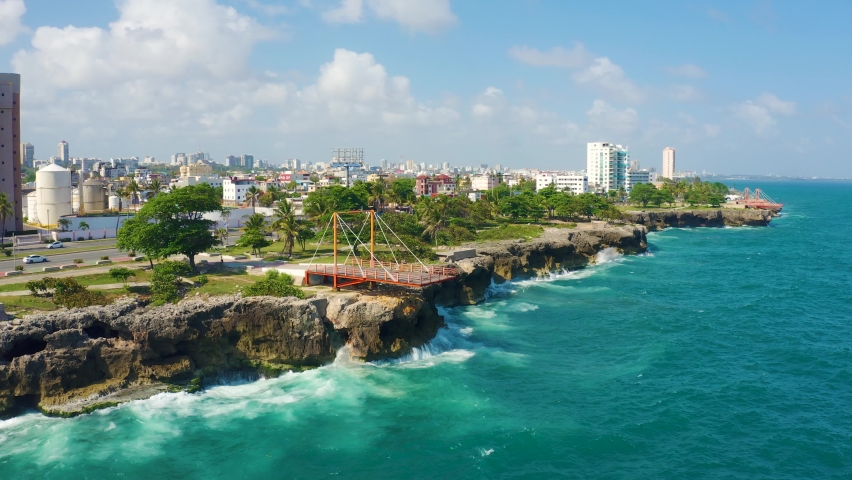 Santo Domingo Dominican Republic landscape stock video. A beautiful city by the sea background. Houses and streets of the city by the ocean. Royalty-Free Stock Footage #1071584923
