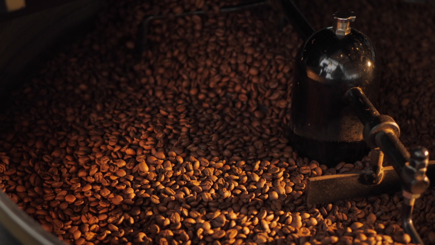 Close up of seeds of coffee. Fragrant coffee beans are roasted, hot aroma coffee and organic freshness, roast coffee industry cooked. Royalty-Free Stock Footage #1071585109