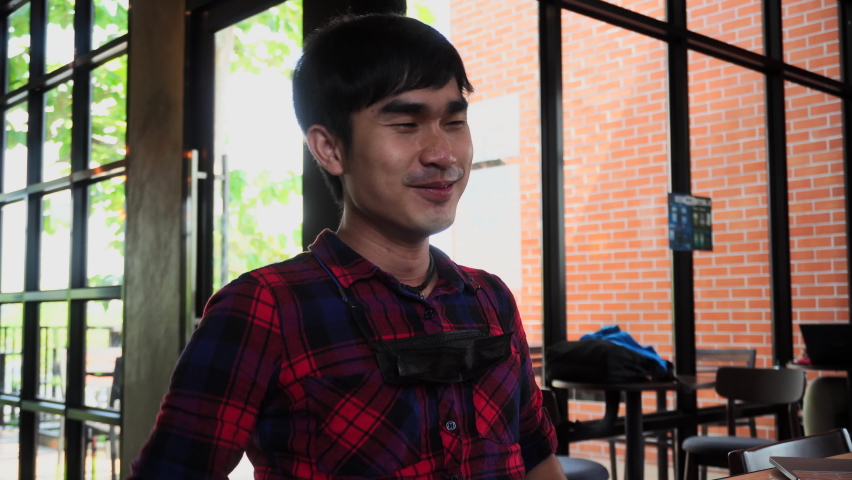 Men working at home smiling happily