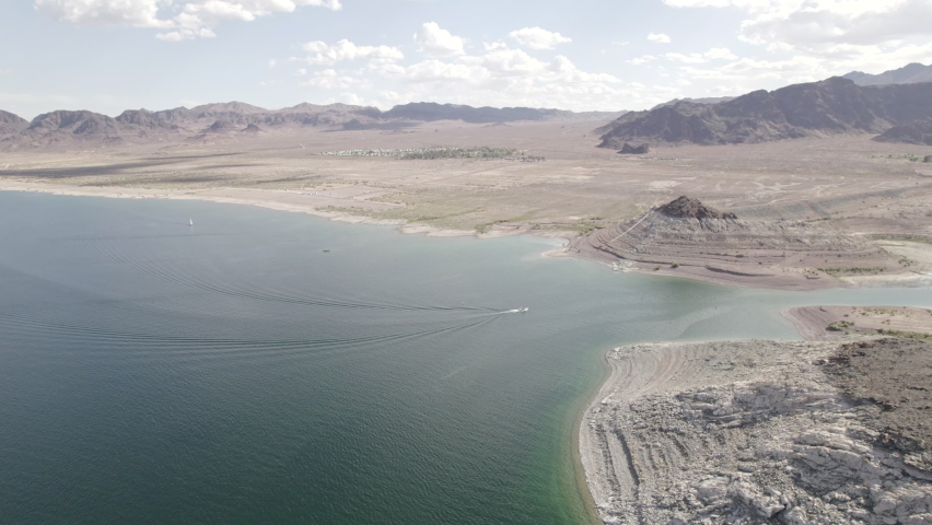 Boat near beach at Lake Mead Las Vegas Boulder City Nevada desert aerial drone 4k ungraded flat log raw footage d-log	