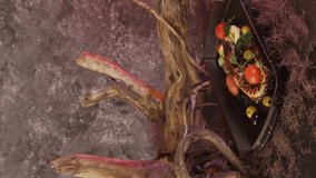 Octopus dishes with beautiful decor. Slow motion picture of food with smoke. Restaurant dish.