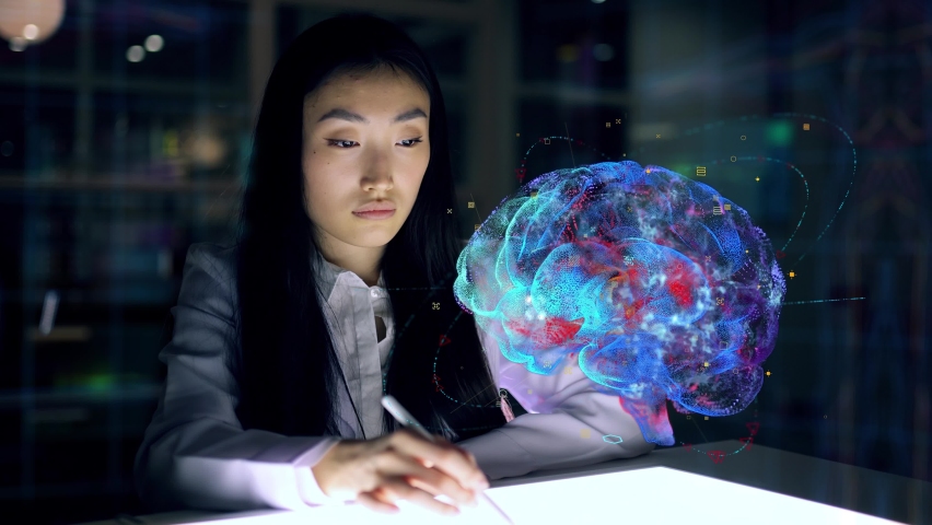 Asian woman Scientist work on 3D Simulated holographic Neural Brain Interface. Engineer using Augmented Holographic Technology. Artificial Intelligence Concept | Shutterstock HD Video #1071600334