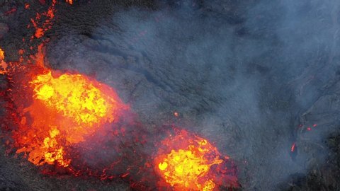 4K Drone aerial video of Iceland Volcanic eruption 2021. The volcano Fagradalsfjall is located in the valley Geldingadalir close to Grindavik and Reykjavik. Hot lava and magma coming out of the crater
