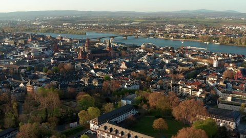 Mainz aerial drone shots on a warm spring day showing the blue river in the back getting and the Cathedral church in the middle