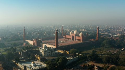 View Of Badshahi Mosque At The Walled City Of Lahore In Punjab, Pakistan During Foggy Day. - Aerial Shot