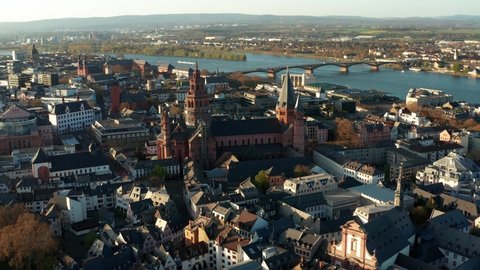 Mainz aerial drone shots around the Cathedral church on a warm spring day showing the blue river in the back