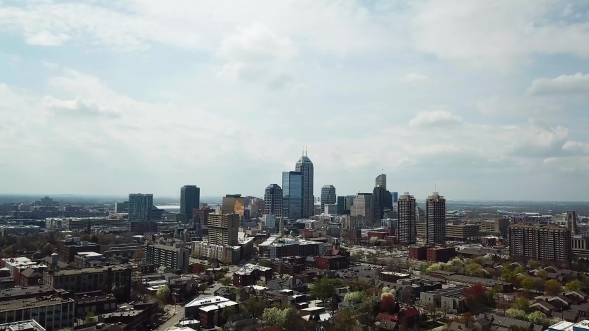 aerial cinematic footage of indianapolis city with cloudy sky and modern futuristic building. urban cityscape building office and skyscraper