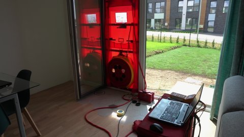 Testing house air-tightness by the blower door test for passive standard house