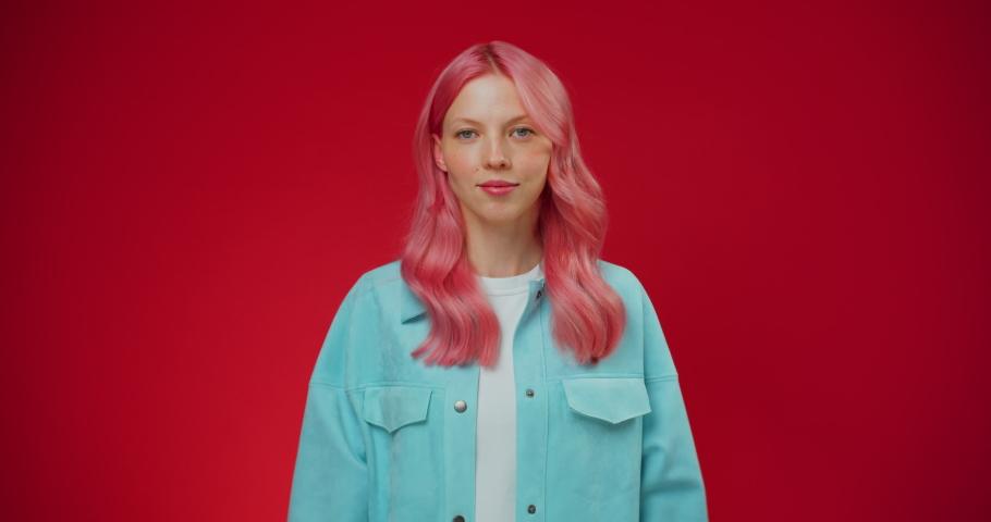 Beautiful young woman with pink hair getting colorful bouquet flowers. Girl getting flowers gift. Man