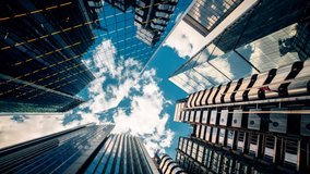 Bottom-up rotating timelapse of important and futuristic skyscrapers in the financial center of a major city - Powered by Shutterstock - Get 15% off with code: PIKWIZARD15