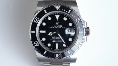 BOLOGNA, ITALY - MARCH, 2020: Rolex Submariner watch close up against white background. Rolex SA is a Swiss luxury watchmaker, founded in London, England in 1905. Illustrative editorial.