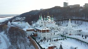 Aerial video: flies close to Orthodox churches and flies close between golden crosses, winter in Russia