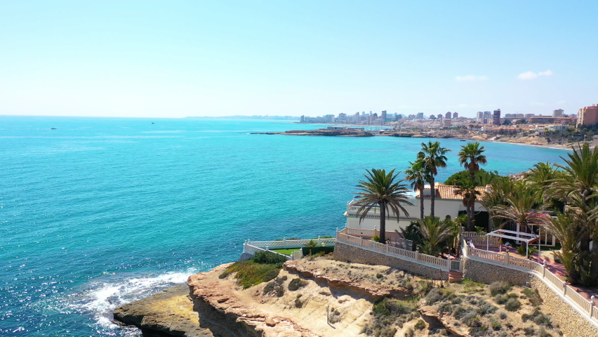 Aerial view of the seashore in the Spanish Mediterranean coast of Campello, Alicante, Spain. | Shutterstock HD Video #1071656926