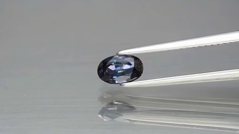 natural blue sapphire gemstone on the turning table