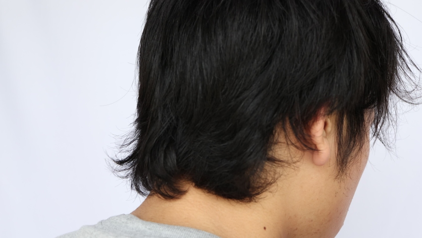 Habitual hair at the back of the head in Japanese men. Royalty-Free Stock Footage #1071706999