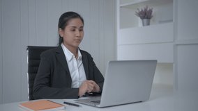 Business concept of 4k Resolution. Asian women are presenting their jobs using computers in the office.