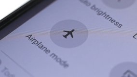 Macro close up of airplane mode button pressed on a LCD display
 - Powered by Shutterstock - Get 15% off with code: PIKWIZARD15